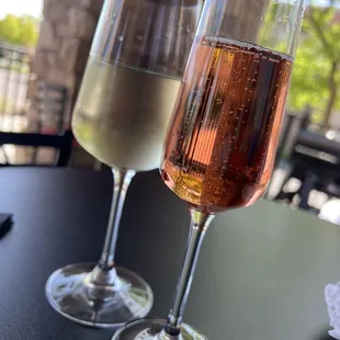 two glasses of wine on a table
