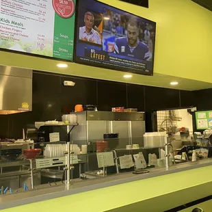 a restaurant counter and menus