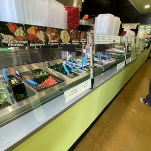 a variety of salads on display
