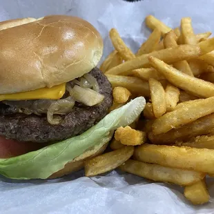 Cheeseburger with grilled onion and a side of fries