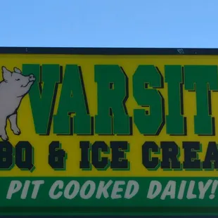 sign for varsityy bbq and ice cream pit cooked daily