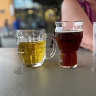 two glasses of beer on a table