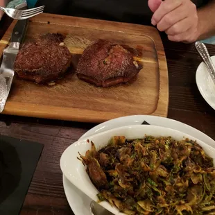 Steak night! Two steaks for the price of one. Shredded Brussel sprouts on the side
