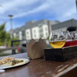 a beer and a plate of food
