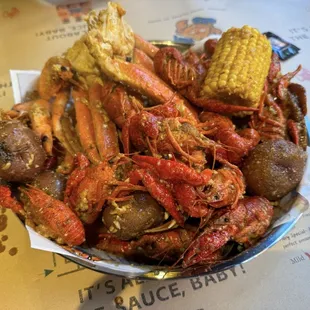 Snow crab, live crawfish, shrimp in garlic butter with side of their fantastic fiery crab sauce