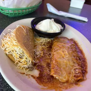 Hard shell ground beef taco without lettuce and a cheese enchilada