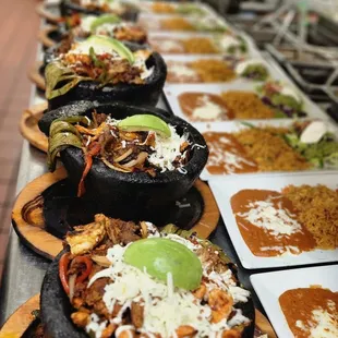 a long line of plates of food