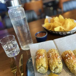 Street Corn with table tortilla chips and salsa.