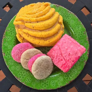 a plate of cookies and pastries