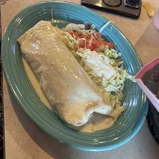 Burrito smothered in queso sauce