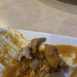 That is the fat in the chili Colorado  stay away from that unless you like fat meat