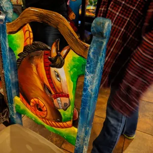 a horse painted on a chair