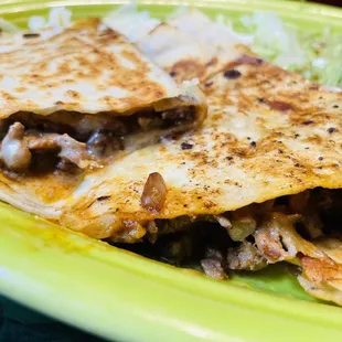 Fajita steak, mushroom, and onion quesadilla