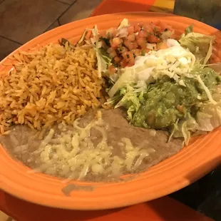 Texas Fajitas Served with guacamole, pico de galo, sour cream, lettuce, rice. Beans, and corn tortillas