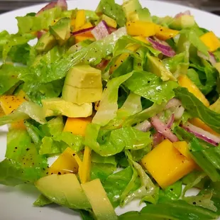 a salad with avocado and mangos