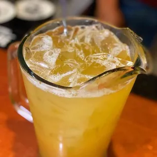 a pitcher of orange juice