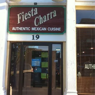 the entrance to a mexican cuisine restaurant