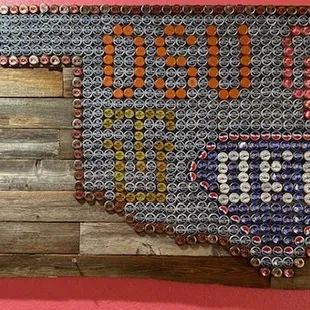 a picture of a mexican flag made out of soda cans