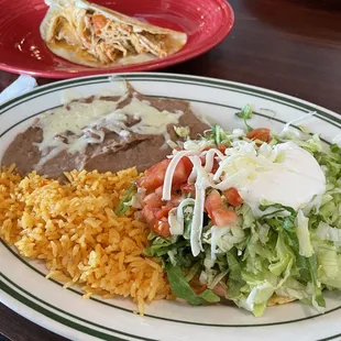 Lunch pick two with rice and beans: bean tostada (looks like a salad) and chicken quesadilla