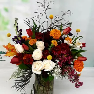 A custom arrangement for one of our lovely customers. If you have something specific in mind, please give us a call.We can design anything!