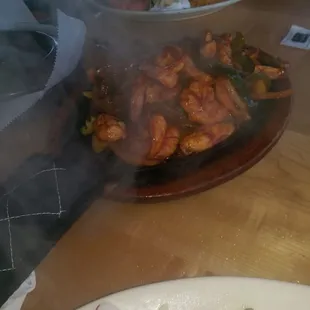 Fajita meat plate. They spice it with a unique red sauce instead of the usual fajita seasonings.