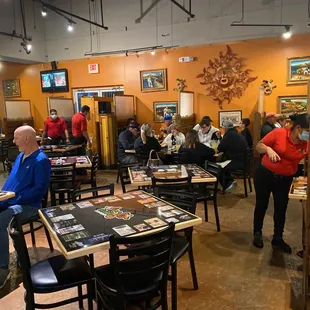 a large group of people sitting at tables