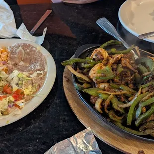 Chicken steak and shrimp fajitas