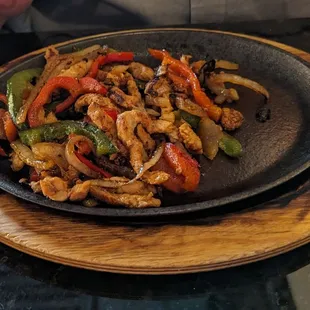 A full portion of fajitas &amp; this was brought this way.  Doesn't even cover the bottom really??????