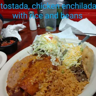 a plate of mexican food with rice and beans