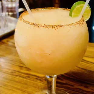 a margarita with a lime garnish