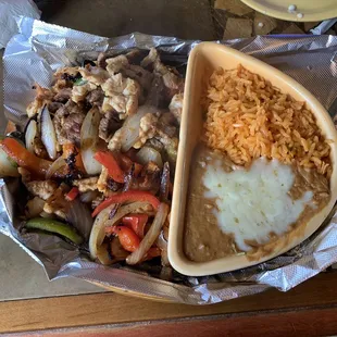 Steak and Chicken Fajitas. Rice and beans.