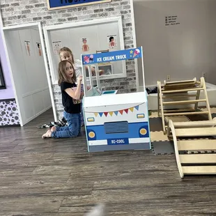 The girls loved playing pretend at the grocery store