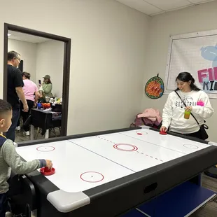 They have air hockey, pool, or ping pong. The adults and kids love this.