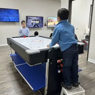 The air hockey table. They even had a step stool for the little ones to reach