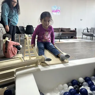 There is a slide for the toddlers.