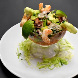 a salad with shrimp and avocado