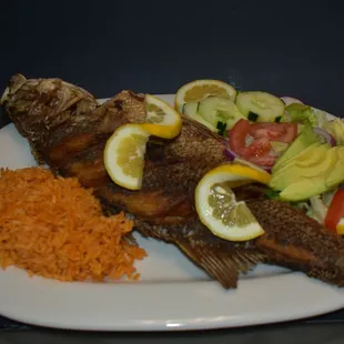 a plate of fish and rice