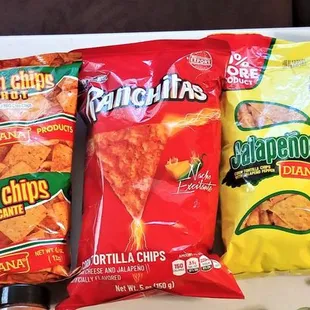 a variety of chips and condiments