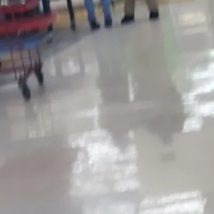 Blurred picture of security guard and store employee involved in the adverse incident.