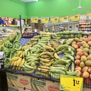 a display of bananas and apples