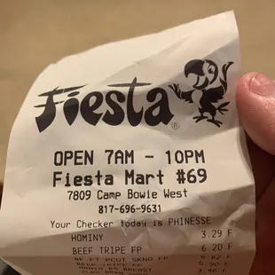 a hand holding a ticket for fiesta