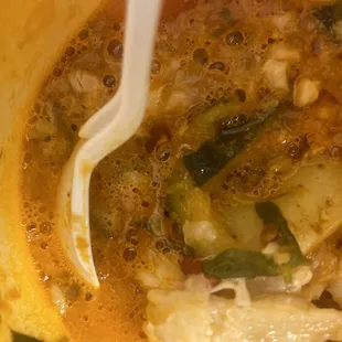 a bowl of soup with a spoon