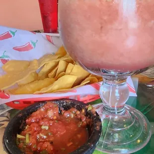 Chips and salsa and prickly pear margarita