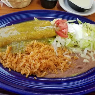 a blue plate with rice, beans, and beans