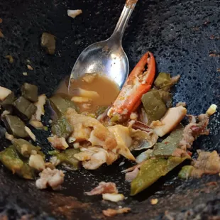 a bowl of food with a spoon in it