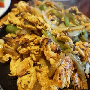 a plate of chicken and vegetables