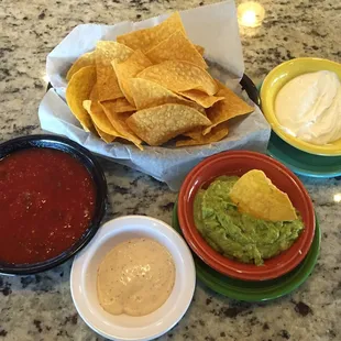 Chips, salsa, sour cream and guacamole.  This is why a person can&apos;t finish their dinner. Lol!