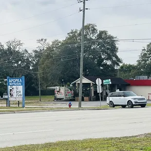 a mexican restaurant on the corner of a street