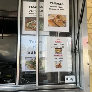 menus on the window of a food truck
