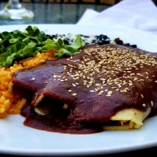 a plate of food with rice and beans